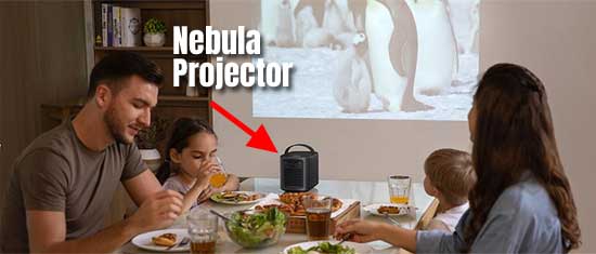 Family Watching Movie on Wall at Dinner with the Nebula Portable Projector